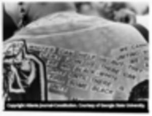 National Black Arts Festival attendee's jacket design featuring a quote from Malcolm X on the back, 1992