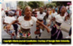 Barefoot Ballet company perform during the National Black Arts Festival parade down Peachtree Street, 1990