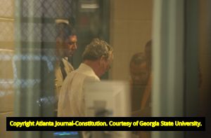 Murder suspect James Sullivan being processed at the Fulton County Jail after being apprehended abroad, 2004