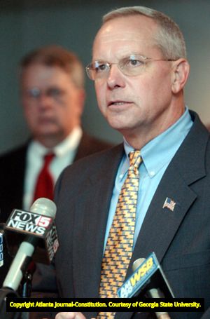 Family members of Lita McClinton and authorities discussing the apprehension of fugitive and murder suspect James Sullivan during a press conference, 2002