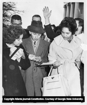 Student Charlayne Hunter navigates student reporters after being one of the first two African American students admitted to the University of Georgia, 1961