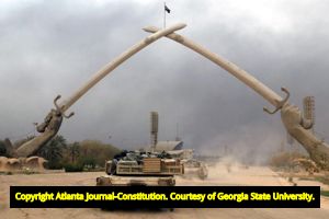 Charlie Company, 1st Battalion, 64th Armor Regiment, 3rd Infantry Division, rolls into downtown Baghdad, 2003