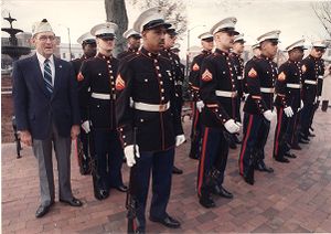 World War II veteran joins Marines at the Naval Air Station in commemoration of Pearl Harbor attack, Atlanta, Georgia, December 7, 1988.