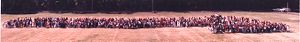 More than 1,000 students standing on a football field in formation, Paul D. West Middle School, East Point, Georgia.