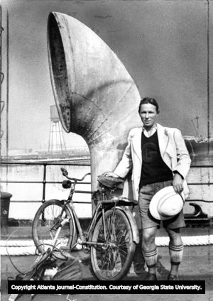 Fred Birchmore and his bicycle on ship docked at San Pedro, California, 1930s