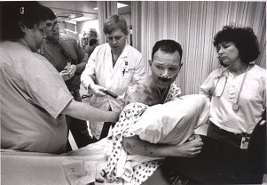 After having difficulty breathing, Tom is taken to University Hospital to have fluid drained from around his lungs, Portland, Oregon, June 29, 1989.