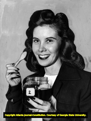 Martha Paris with jar of honey; World War II-era photo, Atlanta, Georgia, 1940s.