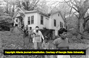 Members of Georgia Action / ACORN during a protest of absentee landlords and poorly maintained vacant housing, Atlanta, Georgia, April 17, 1982.