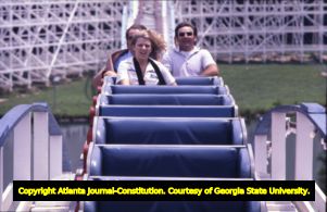 Carter staff on roller coaster, during visit by Amy Carter, Six Flags Over Georgia, Cobb County, Georgia, August 8, 1977.