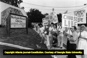 Anti-abortion protestors carrying signs outside the Northside Women's Clinic, Atlanta, Georgia, August 22, 1986.