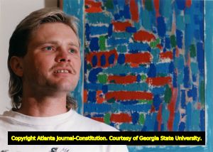 Jeff Higdon, 32, artist with one of his paintings. Lions Lighthouse Foundation paid for laser surgery on his eyes, enabling him to continue his career as an artist, Stockbridge, Georgia, April 7, 1994.