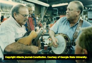 Kenneth Hood (left) and Paul Rogers practice guitar and banjo before Cobb-County Georgia "Homecoming Bluegrass Festival," November 3, 1994.