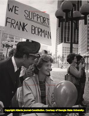 Eastern Airlines pilot and daughter demonstrating their support for Frank Borman