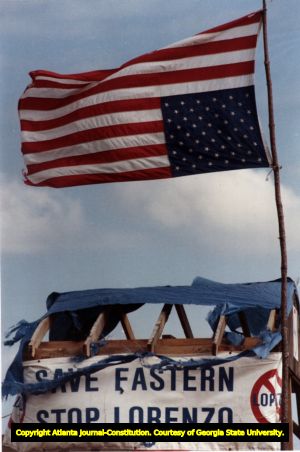 Upside down American flag flies over Eastern Strike headquarters.