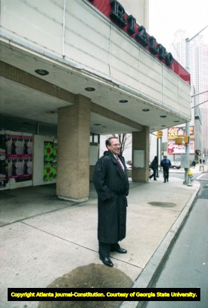 Georgia State University President Carl Patton stands outside the boarded up Rialto Theatre, Atlanta, Georgia, December 15, 1993.
