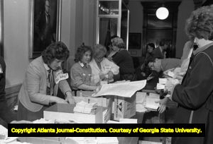 Opponents of the Equal Rights Amendment, distributing anti-feminist literature during the Georgia State House of Representatives' vote on ratification for the ERA, Atlanta, Georgia, January 20, 1982.