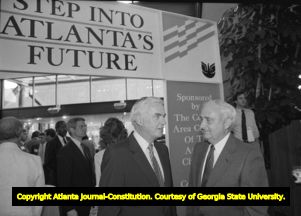 Dan Sweat (right), speaking with an unidentified man at an Atlanta Chamber of Commerce event honoring Sweat, Atlanta, Georgia, July 13, 1988.