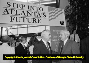 Dan Sweat (right), speaking with an unidentified man at an Atlanta Chamber of Commerce event honoring Sweat, Atlanta, Georgia, July 13, 1988.