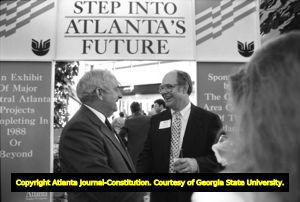 Dan Sweat (left), speaking with an unidentified man at an Atlanta Chamber of Commerce event honoring Sweat, Atlanta, Georgia, July 13, 1988.