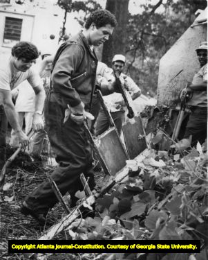 Maynard Jackson, clearing kudzu at first "Annual Great Park Cross Country Run and Kudzu Kaper," Atlanta, Georgia, August 6, 1978.