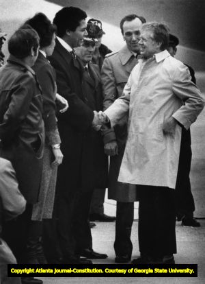 Atlanta Mayor Maynard Jackson greets President Jimmy Carter at Dobbins Air Force Base, Georgia, January 20, 1978.