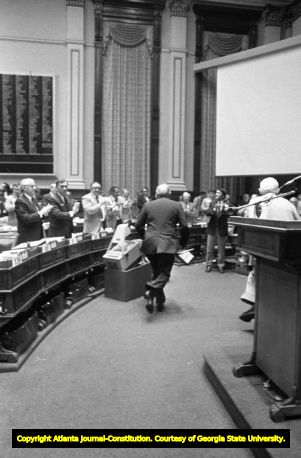 Representative Tom Murphy dancing in front of the Georgia State House of Representatives during debate on ratification of the Equal Rights Amendment, Atlanta, Georgia, January 20, 1982.