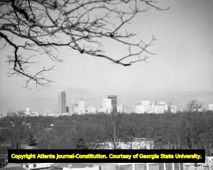 Downtown Atlanta skyline, looking west, through a tree, Atlanta, Georgia, January 1970.