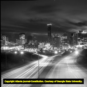 Night photo of downtown Atlanta skyline, looking southwest from the Jackson Street bridge above the Downtown Connector, Atlanta, Georgia, January 21, 1976.