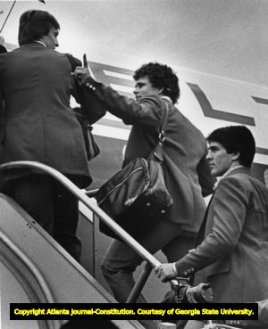 University of Georgia football team boarding plan to New Orleans for the 1980 Sugar Bowl game, Atlanta, Georgia, December 28, 1980.