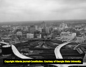 Aerial view of downtown, showing highways built over converging train tracks, Atlanta, Georgia, September 29, 1962.