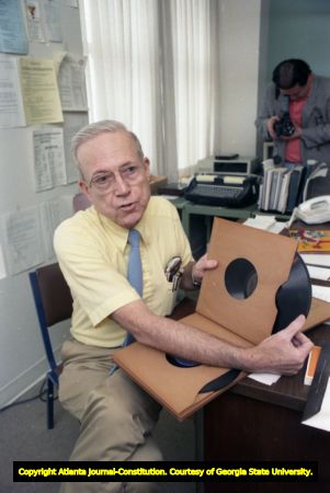 Wayne Daniel, professor of Decision Sciences at Georgia State University, holding a book of 78 rpm records, Atlanta, Georgia, May 25, 1989.