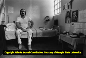 Jack Potts, surrounded by Catholic icons, in his cell at Georgia State Prison, Reidsville, Georgia, June 30, 1980.