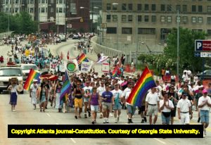 Members from the Emory University group G.L.O.B.A.L. and other participants of the 25th annual Gay Pride Parade marching north on Peachtree Street, Atlanta, Georgia, June 25, 1995.