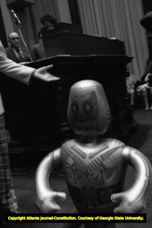Georgia State Senator Culver Kidd and an inflatable robot during the Georgia Senate's vote on the ratification for the ERA, Atlanta, Georgia, January 21, 1980.