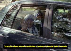 Mother Teresa waving from a car window, Atlanta, Georgia, June 13, 1995.
