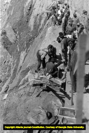 Workmen planting charges to blast the mountain for Tugaloo Dam, after 1910.