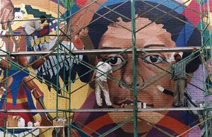 Mural being painted on facade of 7 Stages Theatre, Atlanta, Georgia, May 1992.