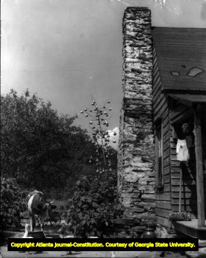 "Martin gourds hang thick in Garnett Simmons' yard on Soapstone Mountain," photograph by R.A. Romanes, Stephens County, Georgia, 1930s?