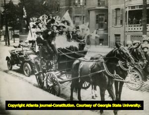 Children of the Confederacy riding in the Memorial Day Parade in front of the Carnegie Library, Atlanta, Georgia, 1910.