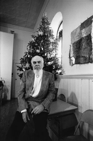 R. Lanier Clance, sitting in front of a Christmas tree, First Existential Church of Atlanta, Atlanta, Georgia, December 17, 1988.