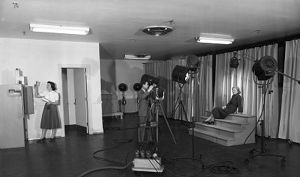 Assistant, photographer, and model during a photo shoot in the Atlanta Journal photography department, Atlanta, Georgia, 1949.