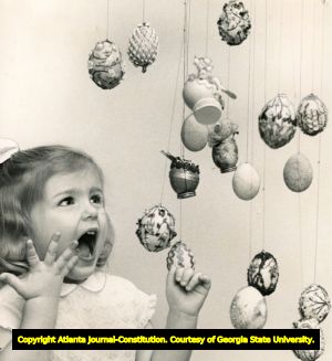 Young girl (Lucia Rawson) with Easter egg, Jekyll Island, Georgia, 1966