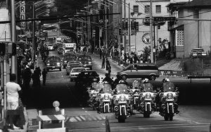 Motorcade escorting South African anti-apartheid leader Nelson Mandela on Auburn Avenue to the Marin Luther King Jr. Memorial Center, Atlanta, Georgia, June 27, 1990.