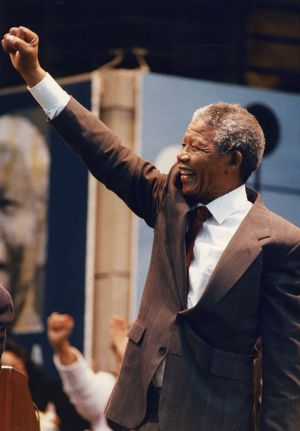 Anti-apartheid leader, Nelson Mandela, greeting a capacity crowd at Bobby Dodd Stadium, Atlanta, Georgia, June 27, 1990.