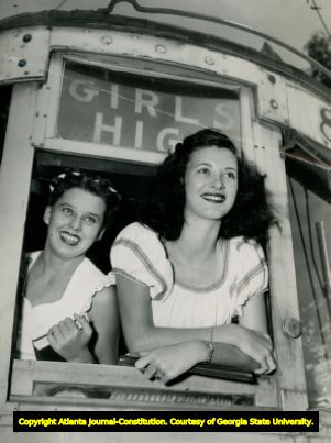 Carolyn Moore and Sue Simpson, ride a special 'Girls High' streetcar, Grant Park area of Atlanta, Georgia, 1946.