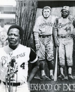 Hank Aaron speaking by a mural depicting him and Babe Ruth, October 2, 1984.