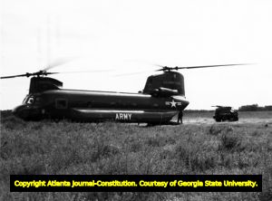 Boeing CH-47 Chinook helicopter being unloaded, Fort Benning, Georgia, 1966?