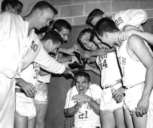 Georgia Tech Yellow Jackets pouring bottles of Coca-Cola over teammate Roger Kaiser, Atlanta, Georgia, January 1, 1961.