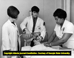 Instructor watches students practice their medical skills for an emergency, Georgia State University, Atlanta, Georgia, February 2, 1971.
