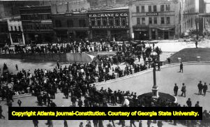 Crowd looks at damage from theTerminal Block Fire, Atlanta, Georgia, May 8, 1908.